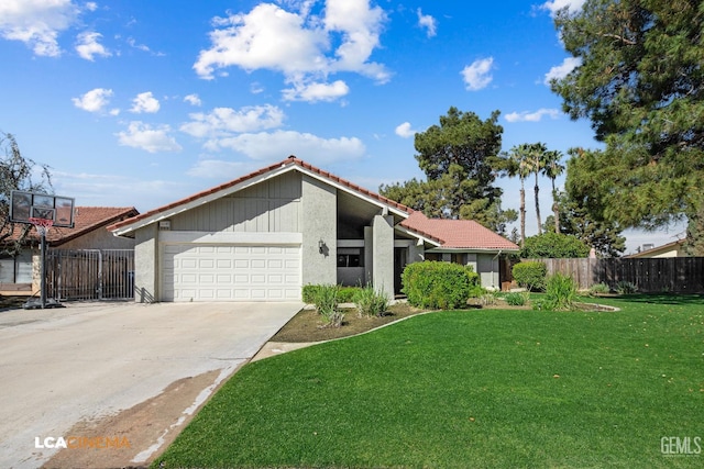 mid-century modern home featuring a front lawn, fence, a tiled roof, driveway, and an attached garage