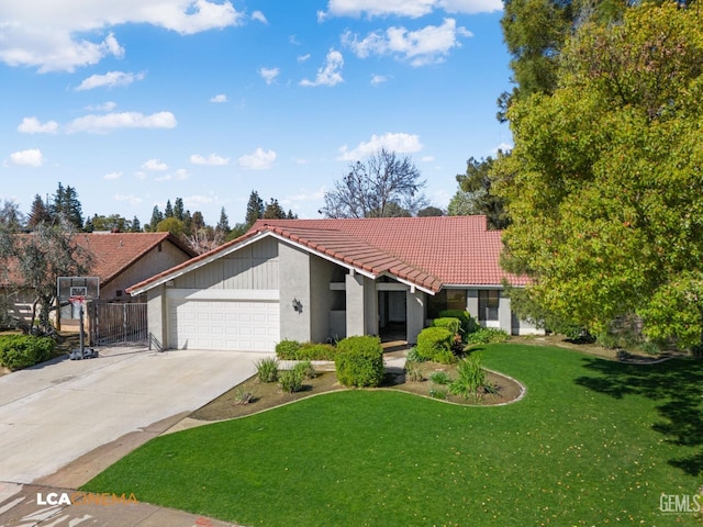 view of front of house featuring stucco siding, a front lawn, concrete driveway, a garage, and a tile roof