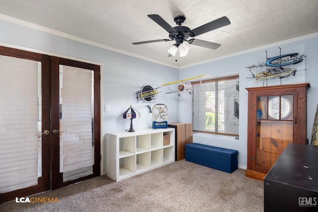 misc room featuring ornamental molding, french doors, ceiling fan, and carpet floors