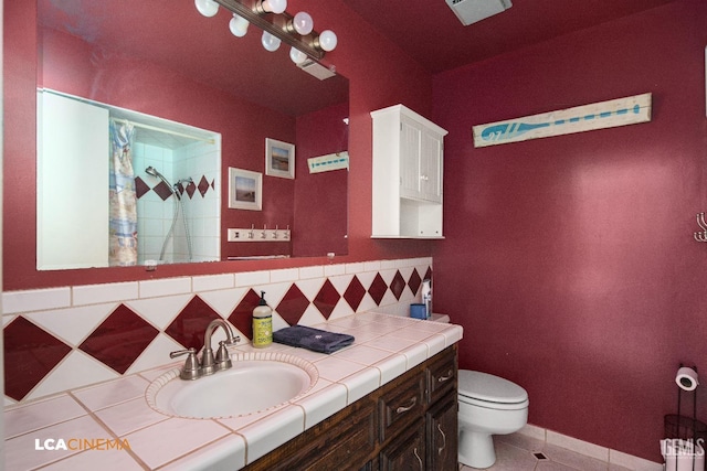 bathroom featuring tasteful backsplash, curtained shower, toilet, tile patterned floors, and vanity