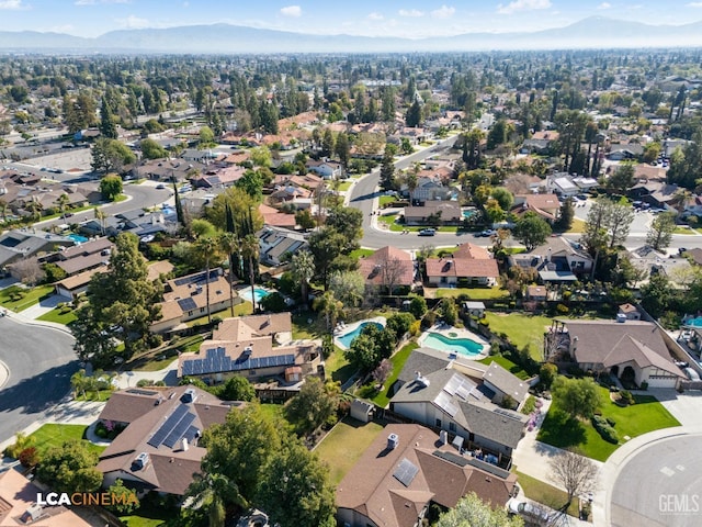 drone / aerial view with a mountain view and a residential view