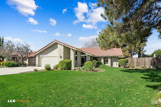 view of front of property featuring a front yard, fence, concrete driveway, a garage, and a tiled roof