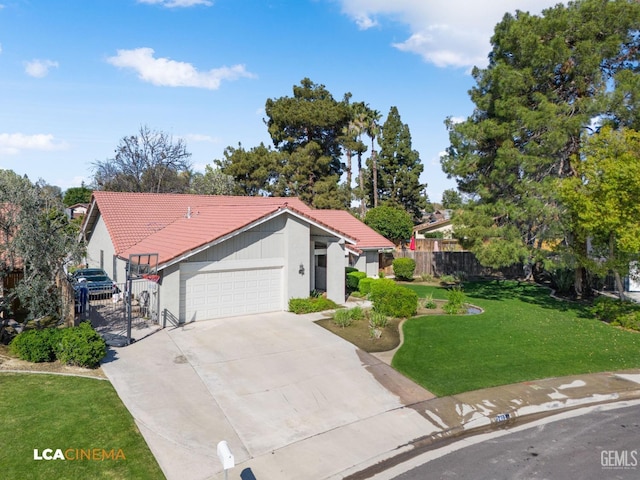 view of front of home with driveway, a front lawn, fence, a garage, and a tiled roof