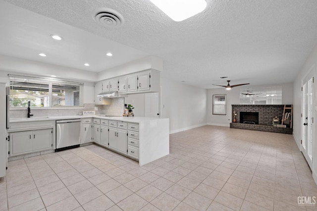 kitchen with visible vents, white cabinetry, open floor plan, light countertops, and dishwasher