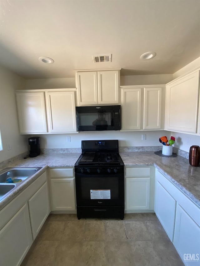 kitchen featuring recessed lighting, black appliances, visible vents, light countertops, and white cabinets