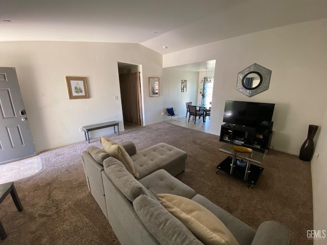 living room featuring vaulted ceiling and carpet