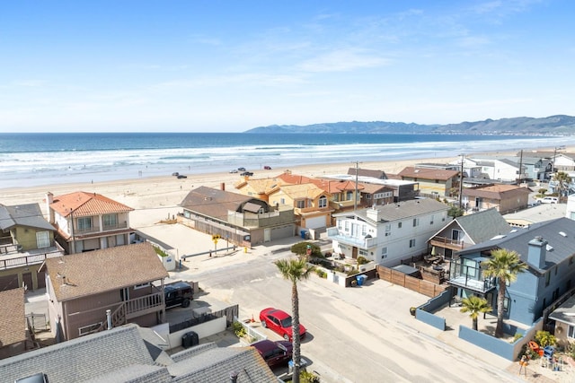 aerial view with a residential view and a view of the beach