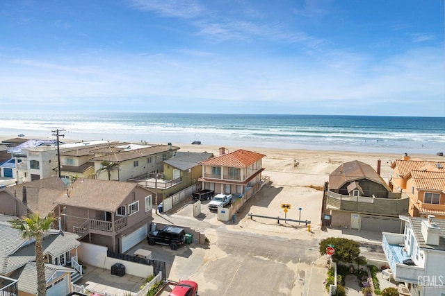 water view featuring a residential view and a beach view