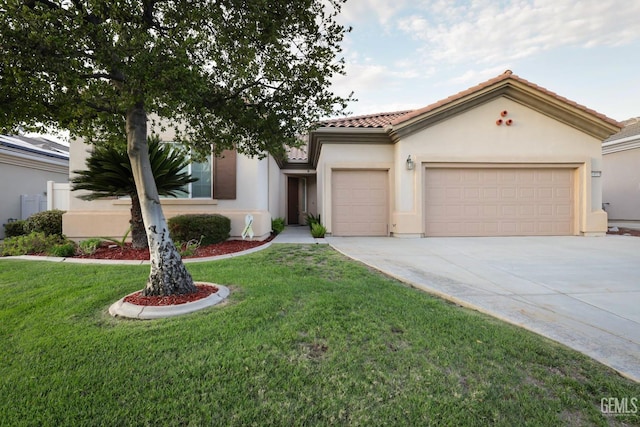 view of front of property featuring a garage and a front yard