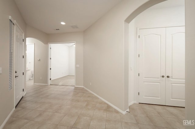 hallway featuring light tile patterned flooring