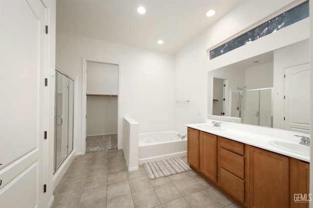 bathroom with vanity, tile patterned floors, and separate shower and tub