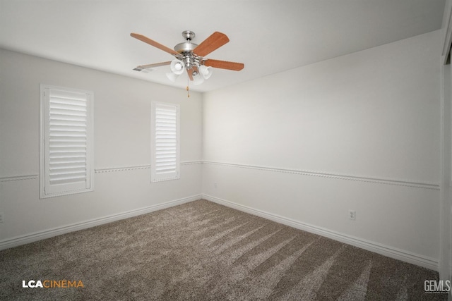 carpeted spare room with ceiling fan