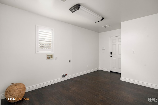 washroom featuring dark hardwood / wood-style flooring, washer hookup, and gas dryer hookup