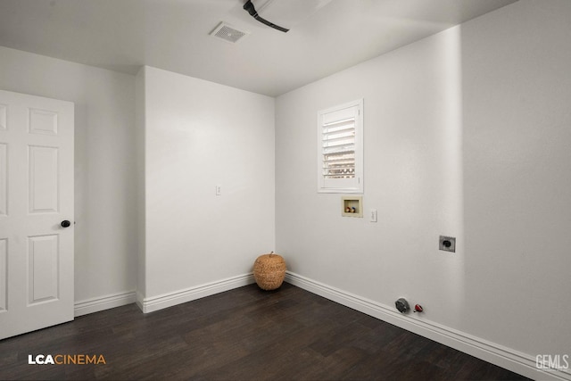 washroom with electric dryer hookup, washer hookup, and dark wood-type flooring