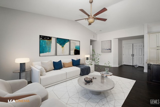 living room with hardwood / wood-style floors, vaulted ceiling, and ceiling fan