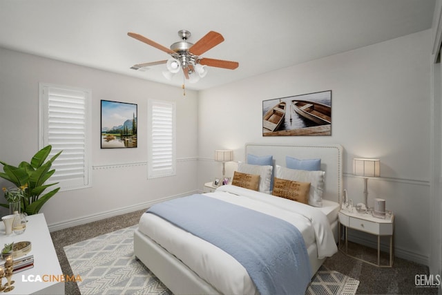 bedroom with ceiling fan and carpet floors