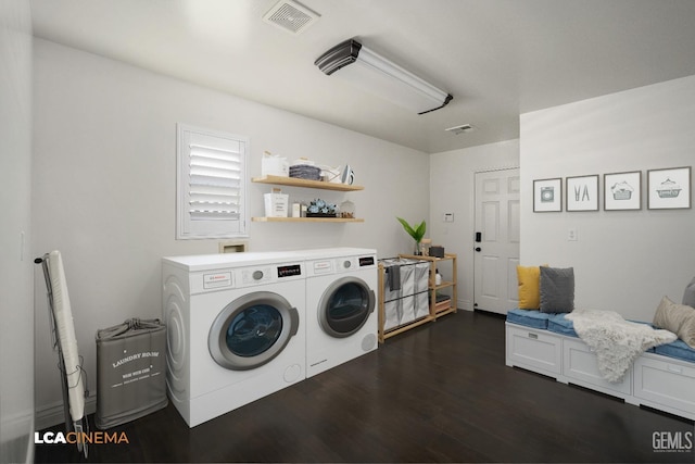 washroom featuring separate washer and dryer and dark hardwood / wood-style flooring