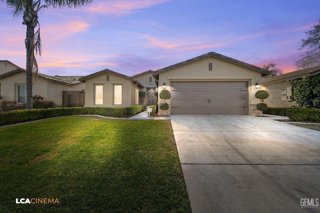 ranch-style house with a garage and a front yard