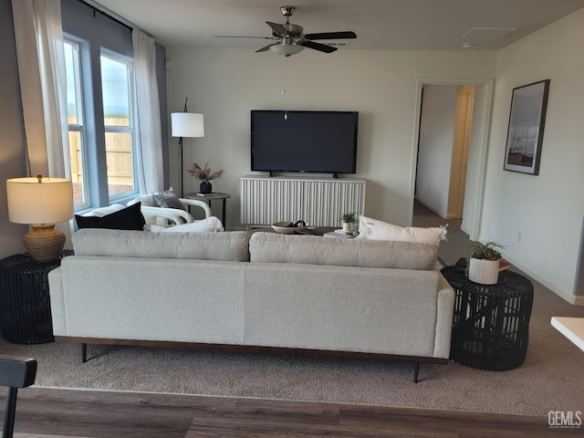 living room featuring hardwood / wood-style flooring and ceiling fan