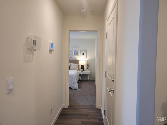 corridor featuring dark hardwood / wood-style floors