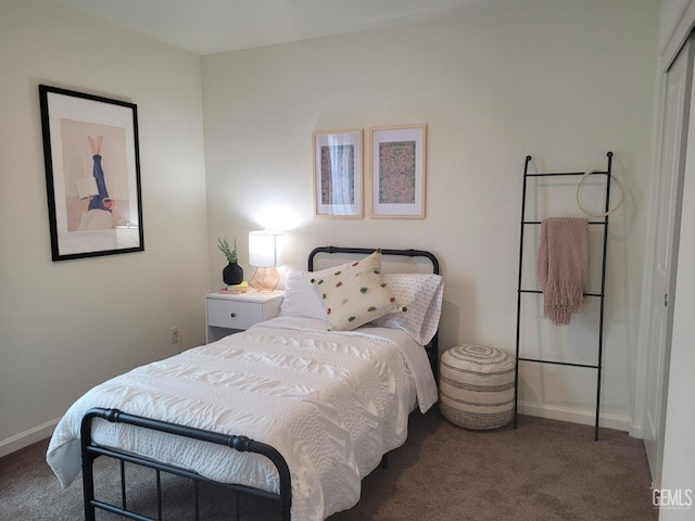 bedroom featuring dark colored carpet