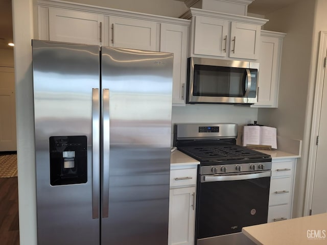 kitchen featuring white cabinetry and stainless steel appliances