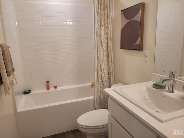 full bathroom featuring vanity, shower / bath combo, and toilet