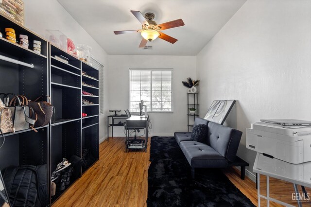 11011 Southwales Ct, Bakersfield, CA 93312 - living area with baseboards, visible vents, ceiling fan, and wood finished floors
