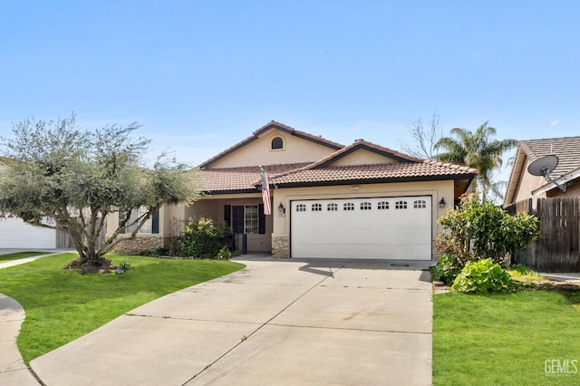 11011 Southwales Ct, Bakersfield, CA 93312 - mediterranean / spanish home featuring a tile roof, stucco siding, an attached garage, driveway, and a front yard