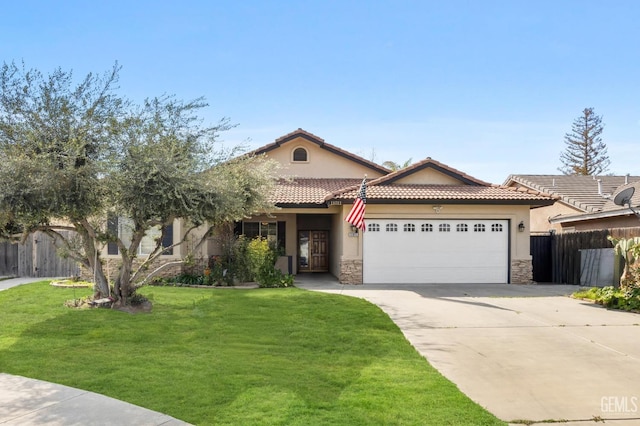 11011 Southwales Ct, Bakersfield, CA 93312 - mediterranean / spanish-style house with concrete driveway, stucco siding, fence, an attached garage, and a front lawn