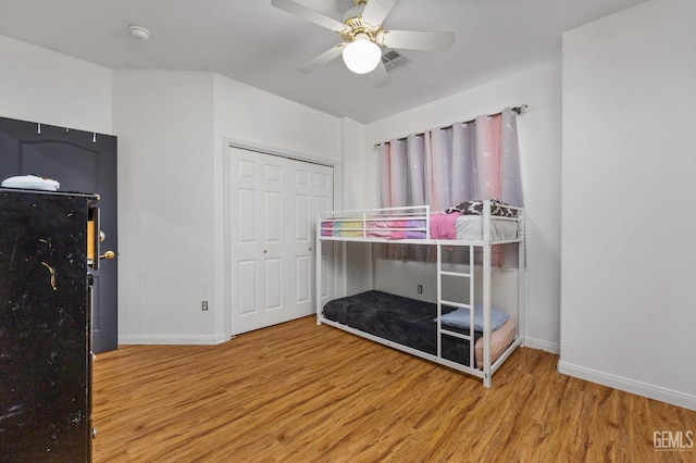 11011 Southwales Ct, Bakersfield, CA 93312 - bedroom featuring a ceiling fan, a closet, baseboards, and wood finished floors