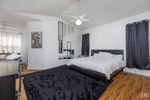11011 Southwales Ct, Bakersfield, CA 93312 - bedroom with baseboards, vaulted ceiling, wood finished floors, and a ceiling fan