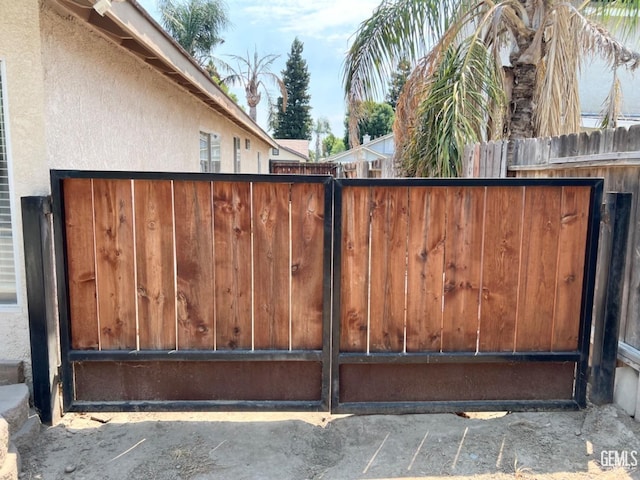 view of gate featuring fence