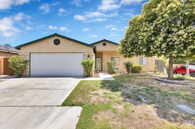 5403 Cascade Ridge St, Bakersfield, CA 93307 - ranch-style home with stucco siding, an attached garage, and concrete driveway