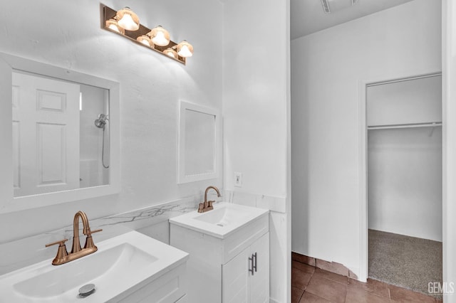 5403 Cascade Ridge St, Bakersfield, CA 93307 - full bath with two vanities, tile patterned flooring, and a spacious closet