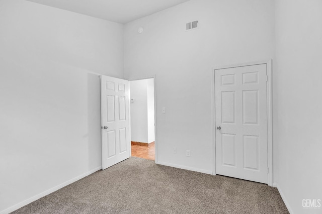 5403 Cascade Ridge St, Bakersfield, CA 93307 - unfurnished bedroom featuring carpet floors and a high ceiling