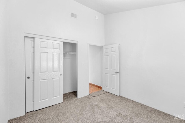 5403 Cascade Ridge St, Bakersfield, CA 93307 - unfurnished bedroom featuring carpet, a closet, and a towering ceiling