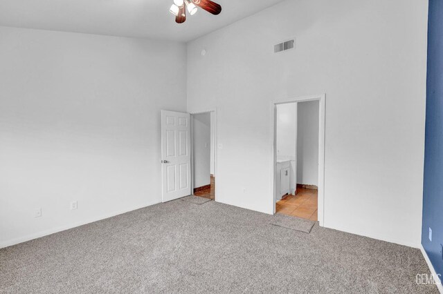 5403 Cascade Ridge St, Bakersfield, CA 93307 - unfurnished bedroom featuring light colored carpet, a high ceiling, ensuite bathroom, and ceiling fan