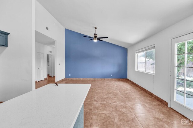 5403 Cascade Ridge St, Bakersfield, CA 93307 - unfurnished living room with lofted ceiling, a ceiling fan, and light tile patterned floors