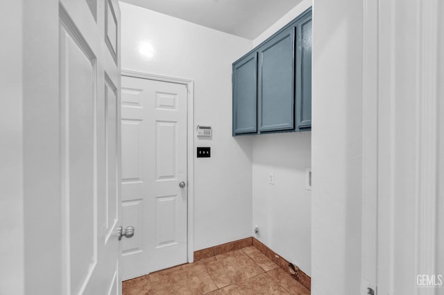 5403 Cascade Ridge St, Bakersfield, CA 93307 - washroom featuring cabinet space, light tile patterned flooring, and electric dryer hookup