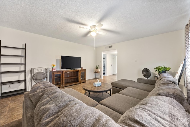3700 Wenatchee Ave, Bakersfield, CA 93306 - living area featuring a ceiling fan, visible vents, and a textured ceiling