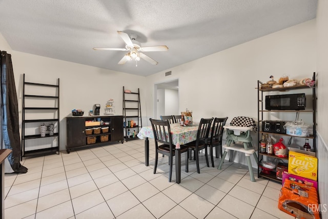 3700 Wenatchee Ave, Bakersfield, CA 93306 - dining area featuring ceiling fan, a textured ceiling, light tile patterned floors, and visible vents