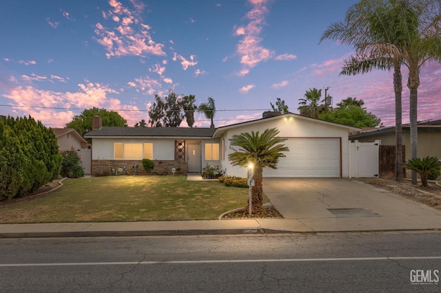 3700 Wenatchee Ave, Bakersfield, CA 93306 - ranch-style house with a garage, stucco siding, fence, concrete driveway, and a front yard