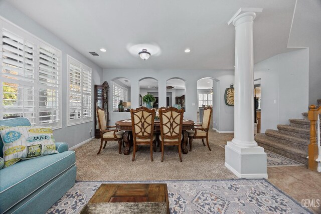 8628 Sandpines Dr, Bakersfield, CA 93312 - dining area with decorative columns, carpet flooring, stairs, baseboards, and recessed lighting