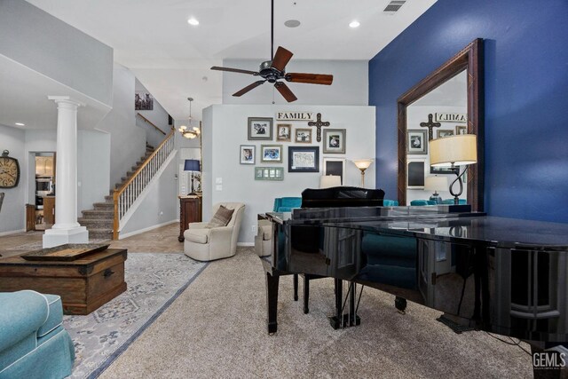8628 Sandpines Dr, Bakersfield, CA 93312 - sitting room with a ceiling fan, stairs, ornate columns, recessed lighting, and carpet floors