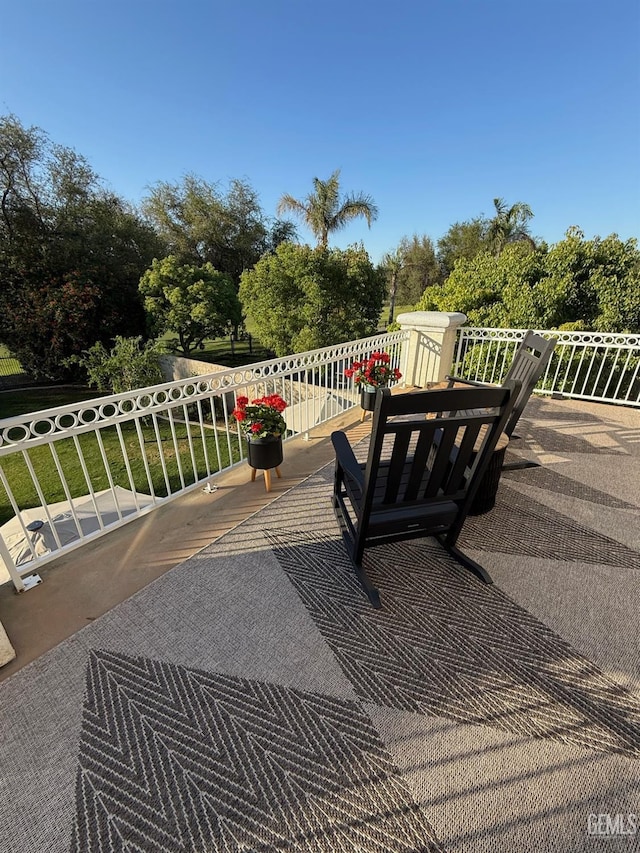 8628 Sandpines Dr, Bakersfield, CA 93312 - view of patio with a balcony and view of scattered trees
