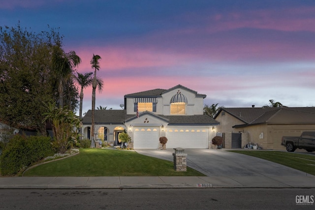 8628 Sandpines Dr, Bakersfield, CA 93312 - view of front of house featuring stucco siding, driveway, a front yard, and a garage
