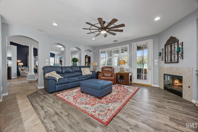 8628 Sandpines Dr, Bakersfield, CA 93312 - living area featuring ceiling fan, a fireplace, baseboards, wood finished floors, and recessed lighting