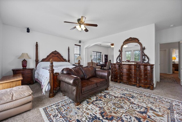 8628 Sandpines Dr, Bakersfield, CA 93312 - bedroom featuring carpet floors, arched walkways, and ceiling fan