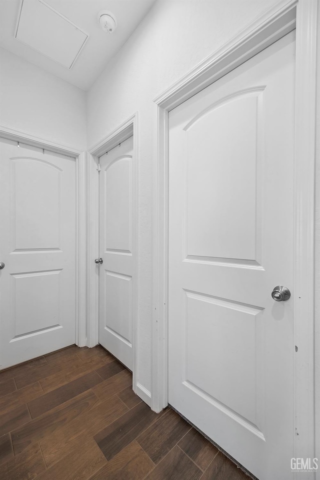 3116 Seymour St, Tulare, CA 93274 - hallway featuring dark wood finished floors and attic access